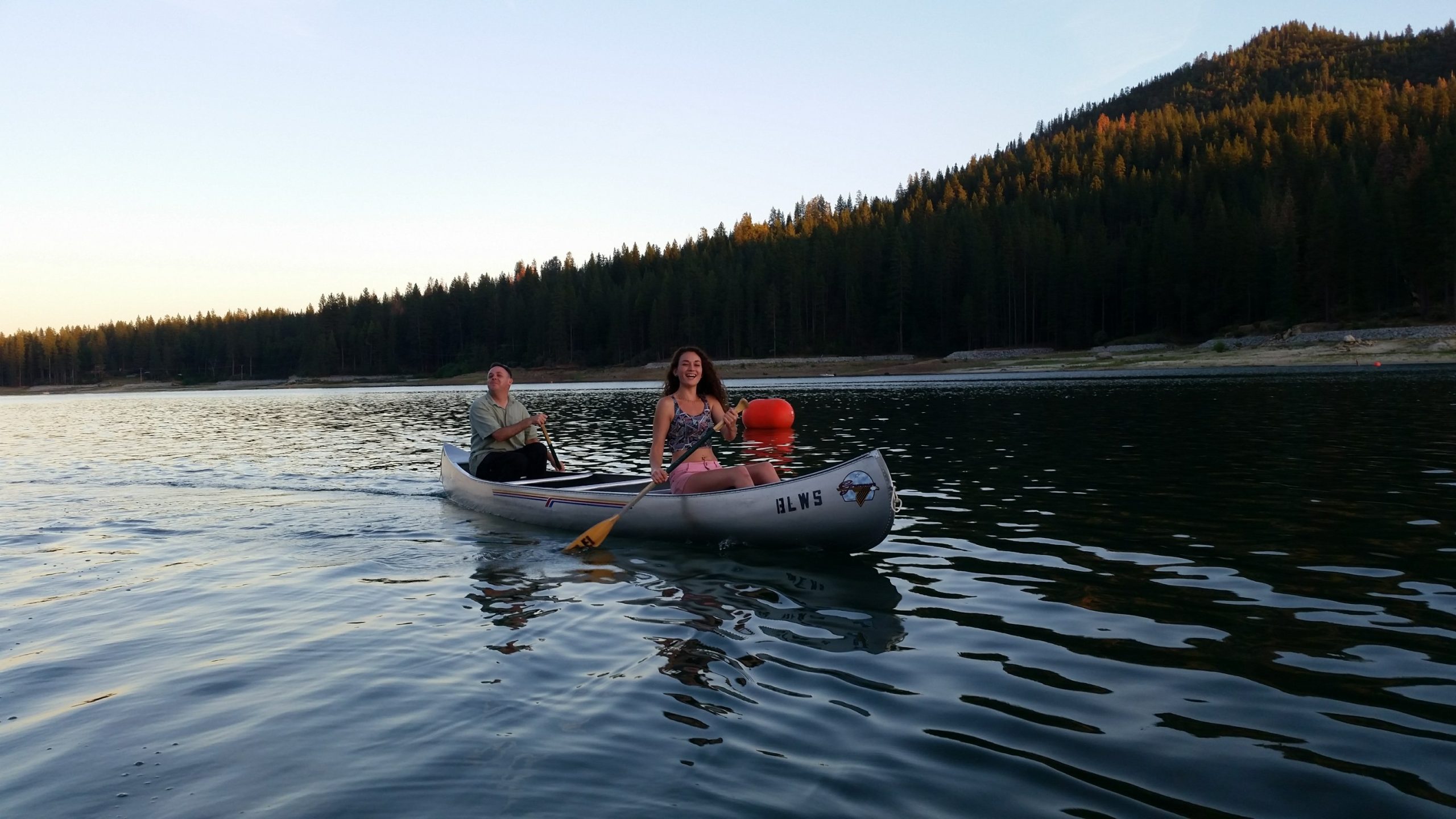 canoeing on a lake at bass lake, california